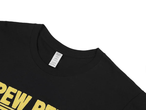 Man wearing black cotton t-shirt with funny graphic of a cat holding guns that reads 'Pew Pew Madafakas'.