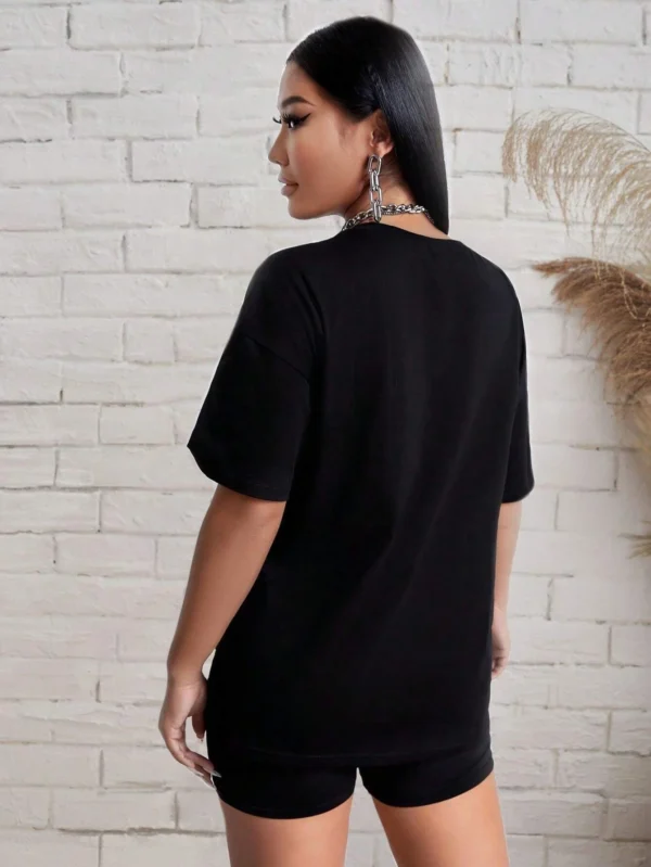 Woman modelling a comfortable butterfly print t-shirt and matching shorts set - summer casual wear.