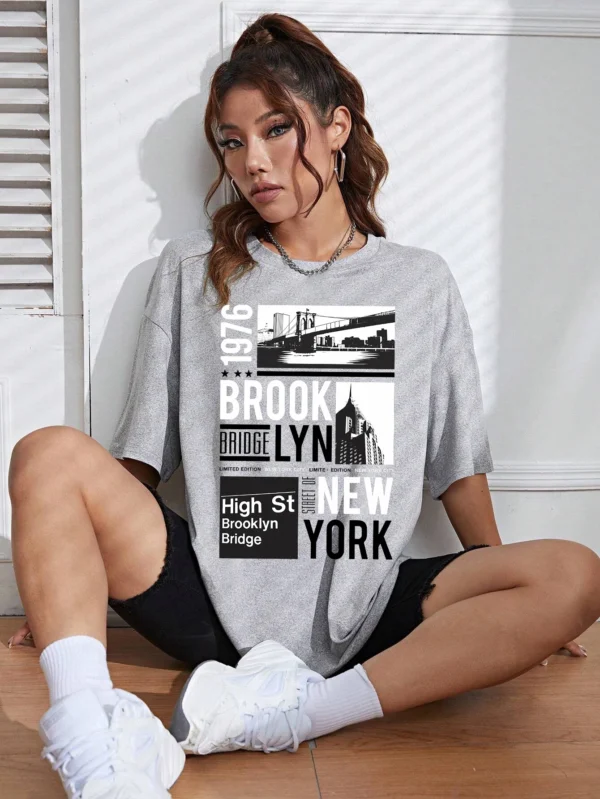 Woman wearing casual white t-shirt with retro "Brooklyn 1976 New York" graphic print.