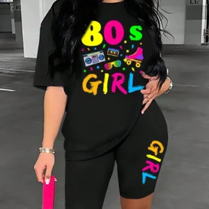 Woman wearing colorful 80s print t-shirt and matching casual shorts two-piece set.
