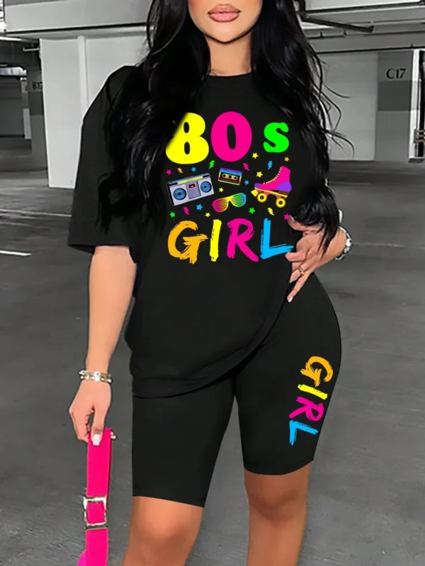 Woman wearing colorful 80s print t-shirt and matching casual shorts two-piece set.