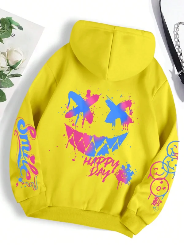 Front view of a woman wearing the oversized graffiti print hoodie