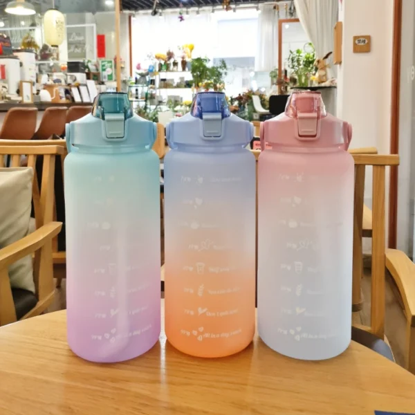 2L motivational plastic water bottle with time markers and leakproof lid for tracking daily hydration.