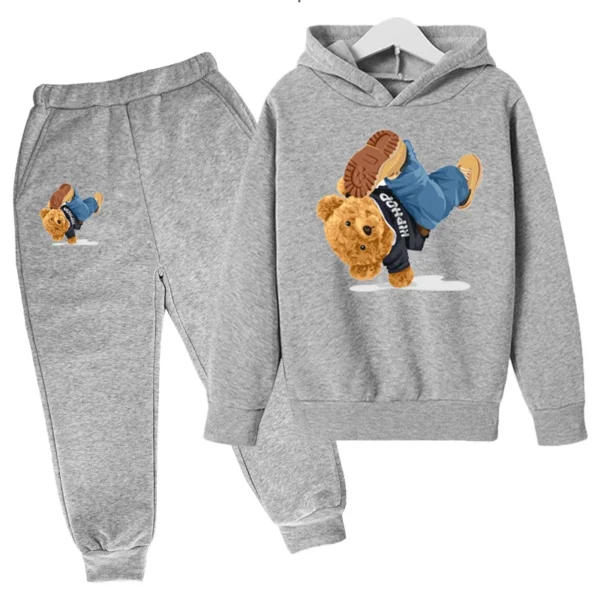 Child wearing fun cartoon bear print hooded tracksuit set with matching pants