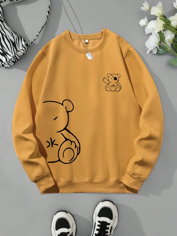 Women's retro beige fleece hoodie with a cute Kawaii teddy bear 'OK' print graphic on the front.