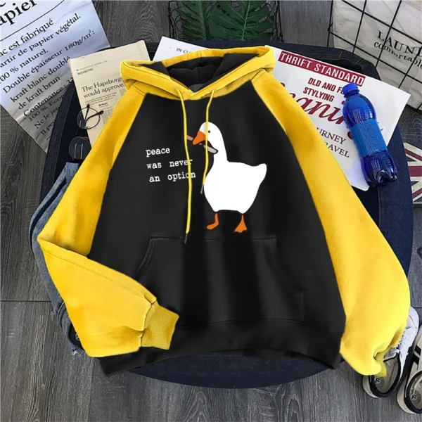 Woman wearing a black "Peace Was Never An Option" printed hoodie.