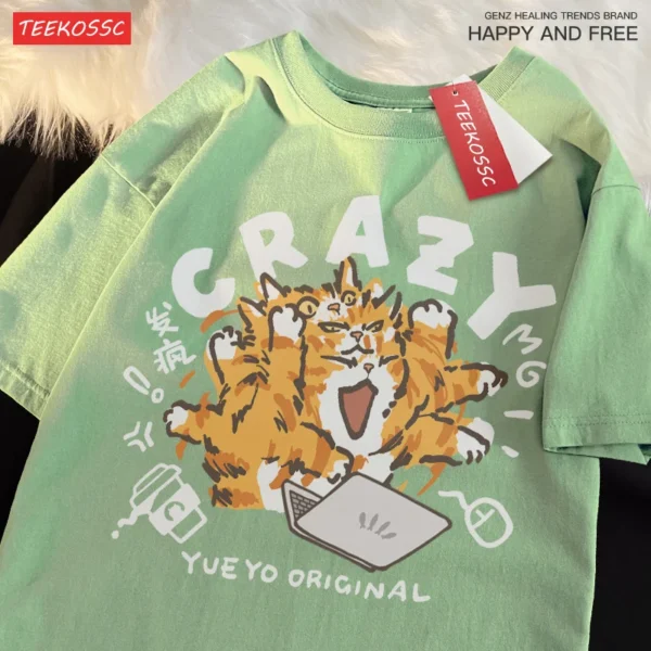 Woman wearing a light green loose-fit cotton t-shirt with a funny orange cat print and shoulder drop sleeves.