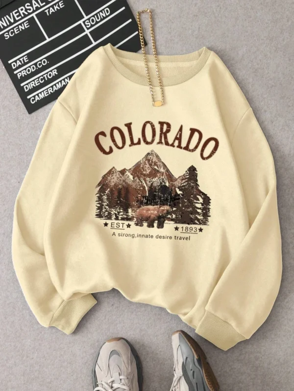 Woman wearing vintage travel print oversized hoodie