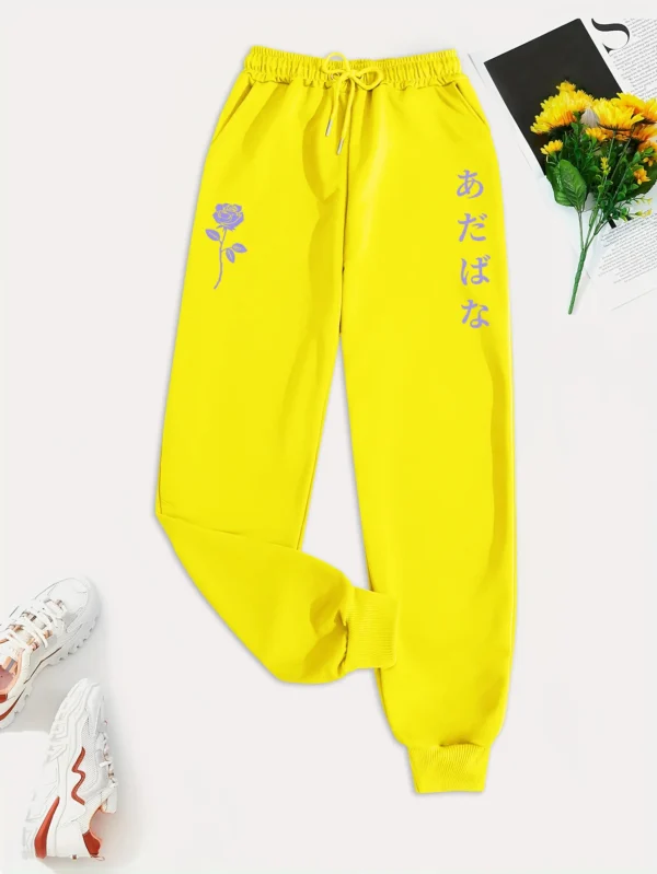 Women's purple hip hop sweatpants with white floral and letter graphic print