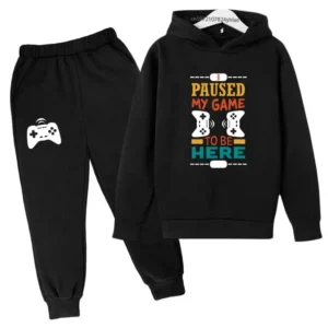 Kids gamer tracksuit set with 'I Paused My Game To Be Here' slogan on hooded sweatshirt and matching pants for boys or girls.