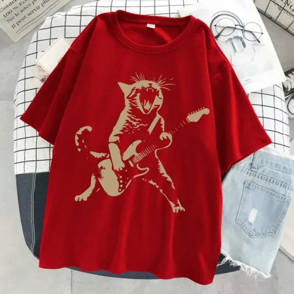 Woman wearing a funny cat playing guitar t-shirt.
