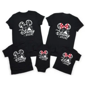 Family wearing matching Mickey and Minnie Mouse cotton shirts and baby romper for Disney trip.