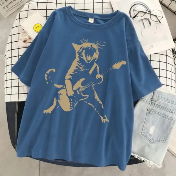 Woman wearing a funny cat playing guitar t-shirt.