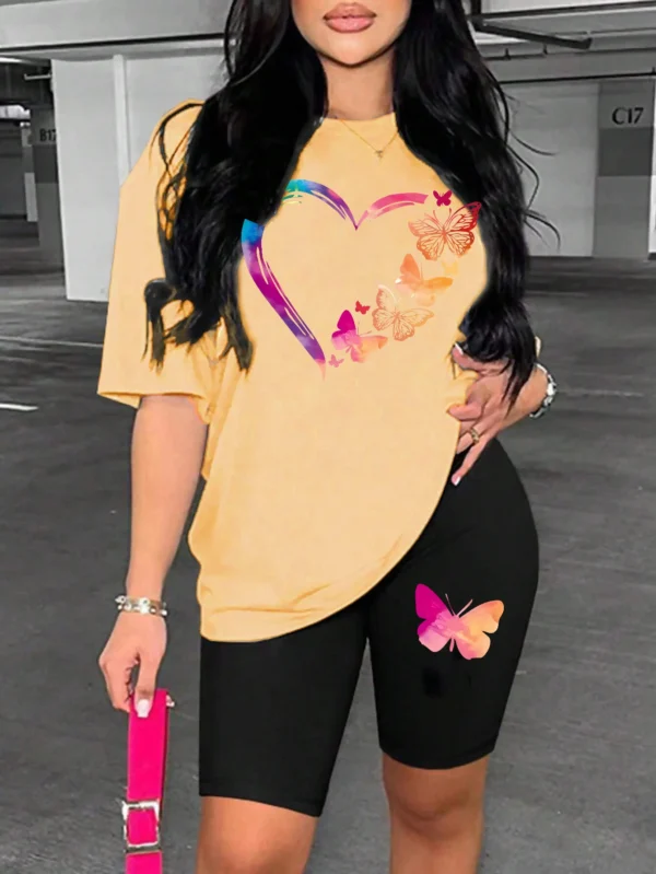 Woman modelling a comfortable butterfly print t-shirt and matching shorts set - summer casual wear.