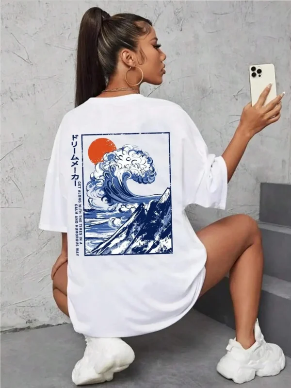 Women's cotton t-shirt featuring a vibrant Japanese wave and sunset graphic print. Relaxed fit.