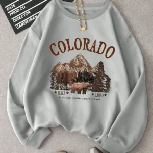 Woman wearing vintage travel print oversized hoodie