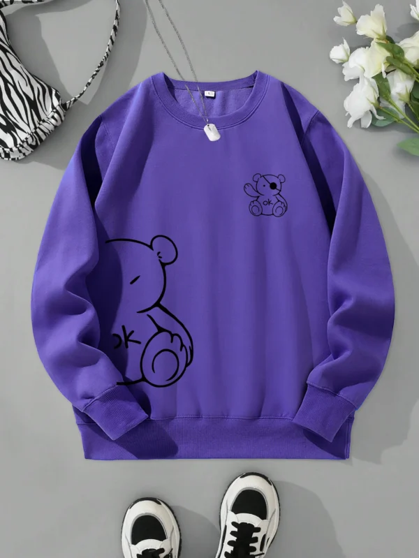 Women's retro beige fleece hoodie with a cute Kawaii teddy bear 'OK' print graphic on the front.