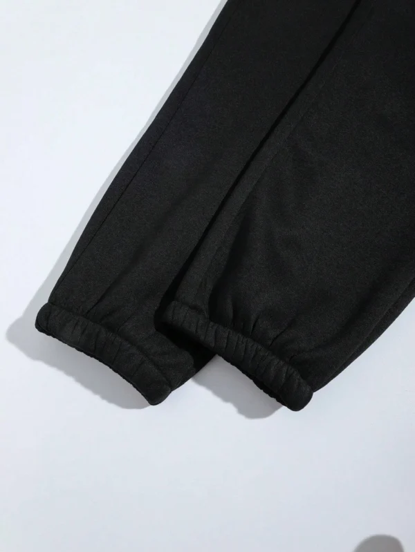Women's pink loose casual hip hop pants with white letter print graphic - streetwear style trousers for autumn/winter.