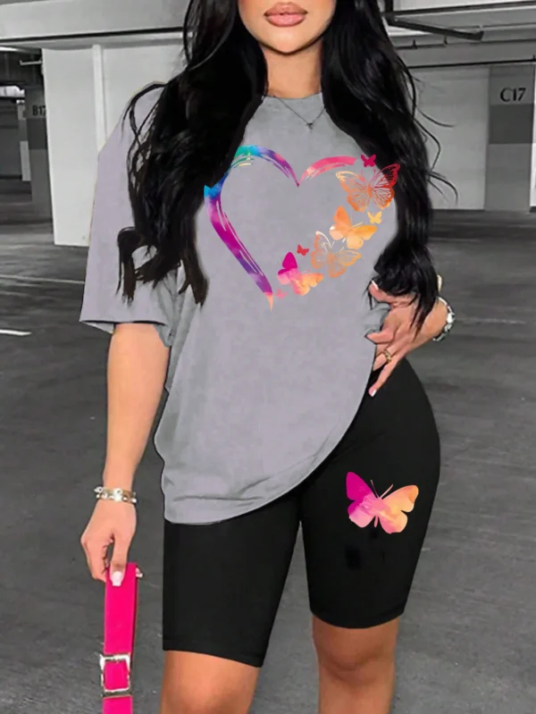 Woman modelling a comfortable butterfly print t-shirt and matching shorts set - summer casual wear.