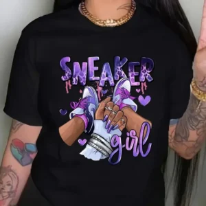 Women's short sleeve crew neck t-shirt with a colourful Kawaii style graphic print featuring a girl and sneakers motif. ```