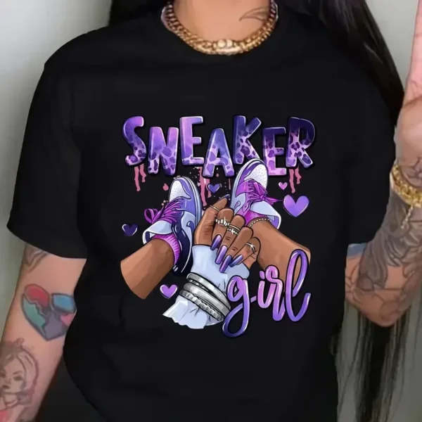 Women's short sleeve crew neck t-shirt with a colourful Kawaii style graphic print featuring a girl and sneakers motif. ```